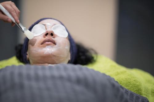a man with glasses and a toothbrush in his mouth at Solana Hotel & Spa in Mellieħa