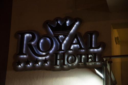 a sign for a hotel with a crown on it at Royal Hotel in Cosenza