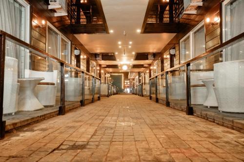an empty hallway of a building with a long aisle at Sinon Baga Retreat in Baga