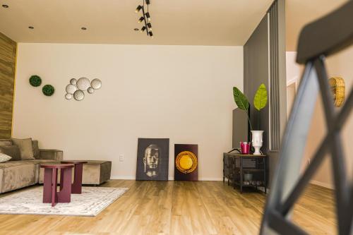 a living room with a couch and a table at IoanaGuestHouse in Turda