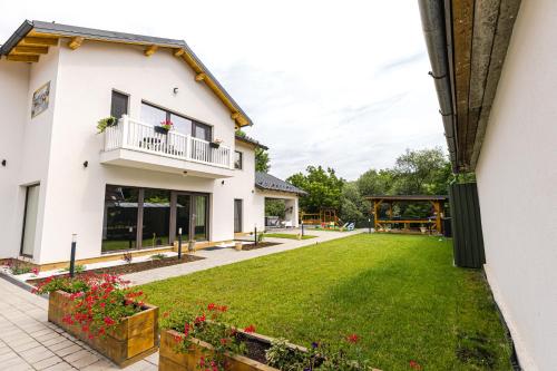 a view of the garden of a house at IoanaGuestHouse in Turda