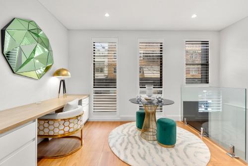 a living room with a table and a rug at Luxurious 3-Story Terrace in Potts Point in Sydney