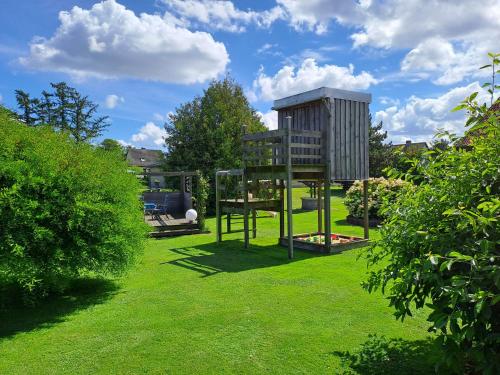 a tree house in the middle of a lawn at Ferienhaus Lara in Katzow