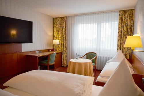 Ένα ή περισσότερα κρεβάτια σε δωμάτιο στο Hotel Zum Schiff