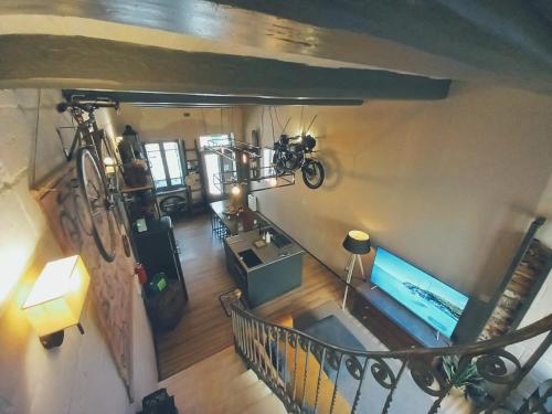 an overhead view of a living room with a bike on the wall at The Anchor Townhouse in St Paul's Bay