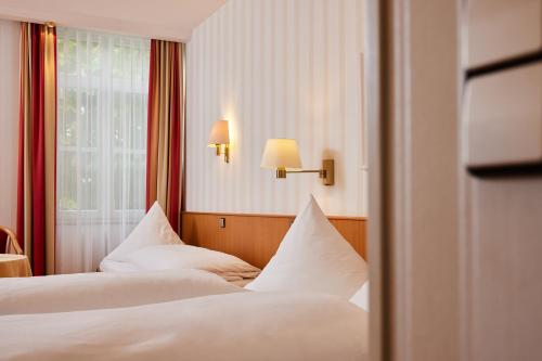 Ένα ή περισσότερα κρεβάτια σε δωμάτιο στο Hotel Zum Schiff