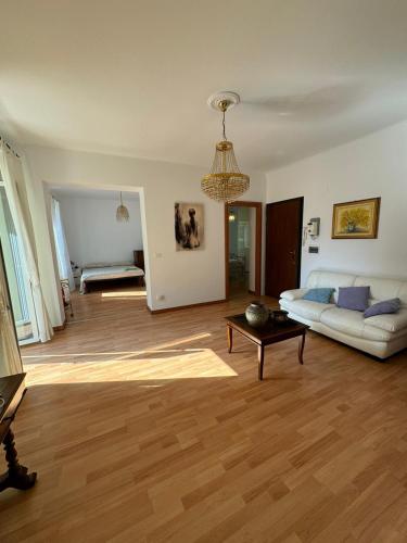 a living room with a couch and a table at Casa Giulia in Genoa