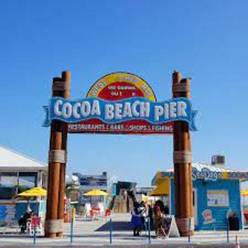 a sign that reads coca cola beach pier at Wonderful Place Wprivate Patio Next To The Beach in Cocoa Beach