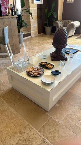 a table with a plate of food on top of it at Villa Brigida Resort in Santeramo in Colle
