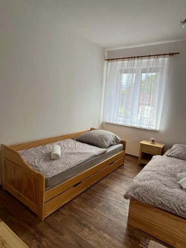Apartmán Pod Sjezdovkouにあるベッド