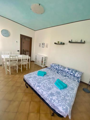 a bedroom with a bed and a table and chairs at Venice Nora's House in Mestre