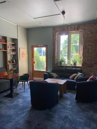 a living room with a couch and a table at La Casa Klippan in Rockneby