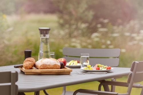 a table with a turkey and a plate of food at SCHLOSS Roxburghe, part of Destination by Hyatt in Kelso