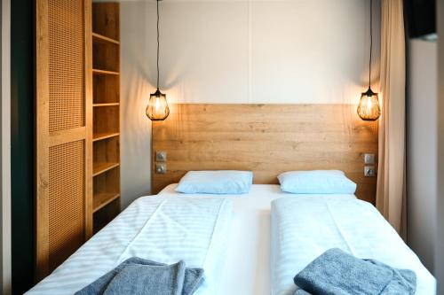 Postel nebo postele na pokoji v ubytování O'Hara Living - Camping Belle-Vue