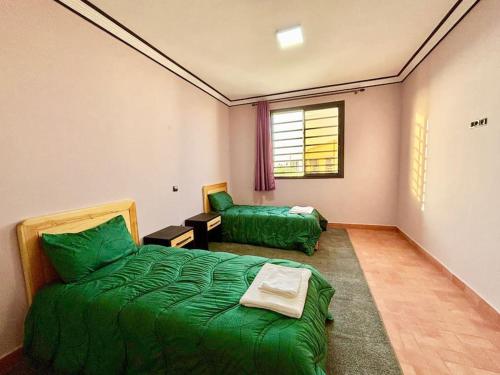 Una cama o camas en una habitación de Aghbalou cabanne