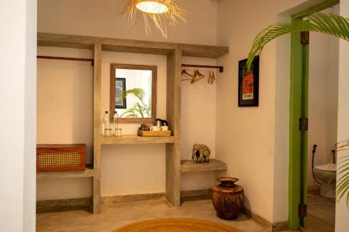 a bathroom with a toilet and a window at Zen Villa in Ahangama