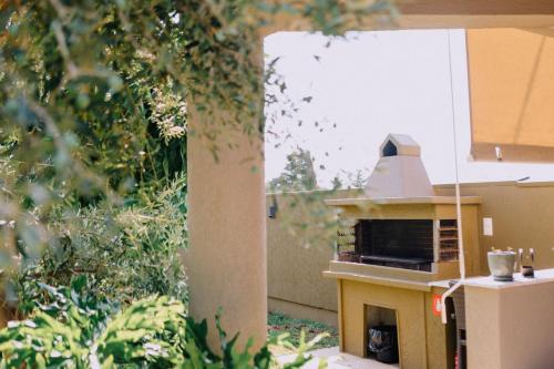 a model of a pizza oven in a backyard at Anassa House in Alexandroupoli