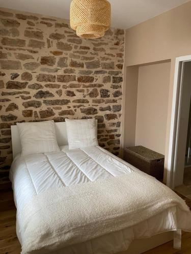 Ένα ή περισσότερα κρεβάτια σε δωμάτιο στο Hilo Charming Appartment Saint Laurent Sur Sane