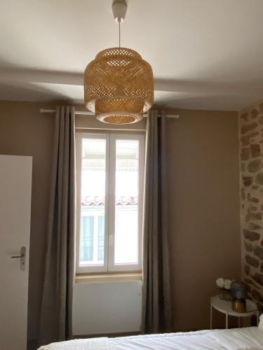 Ένα ή περισσότερα κρεβάτια σε δωμάτιο στο Hilo Charming Appartment Saint Laurent Sur Sane