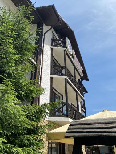 a building with a sign on the side of it at Shulc in Bukovel