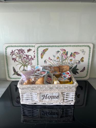 a basket of bread and other foods on a table at Testa tra le Nuvole in Novi Ligure
