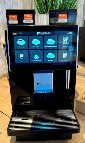 a computer with a screen on top of it at A&T Hotel & Hostel in Vienna
