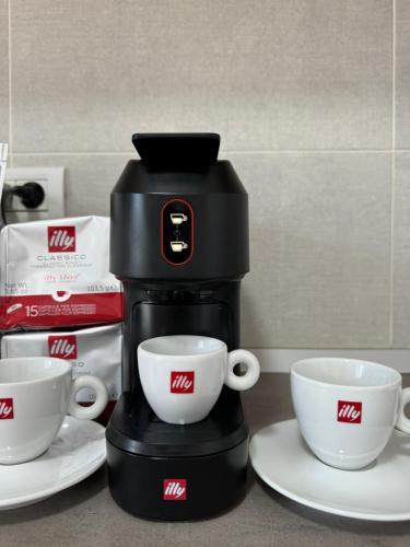 Příslušenství pro přípravu čaje a kávy v ubytování Nicola Flat Mall