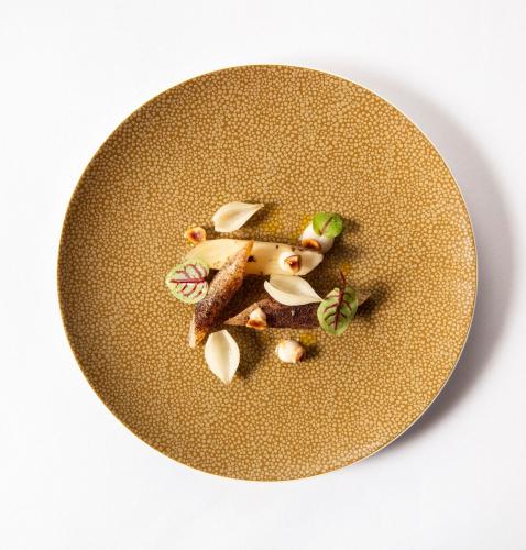 a plate of food on a white background at SCHLOSS Roxburghe, part of Destination by Hyatt in Kelso