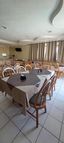 a dining room with a table and chairs at Hotel Praia 2000 in Fortaleza