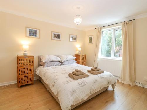 Postel nebo postele na pokoji v ubytování Tiffany's Cottage