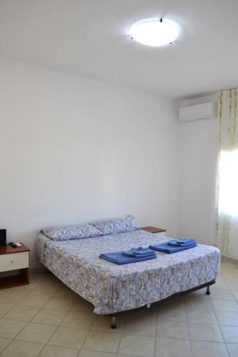 Ліжко або ліжка в номері Pothos' House
