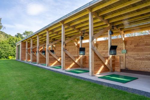 a building with green mats in the grass at SCHLOSS Roxburghe, part of Destination by Hyatt in Kelso