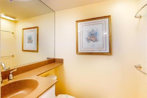 a bathroom with a sink and a mirror at Sea Colony - 509 Dover House Rd. in Bethany Beach