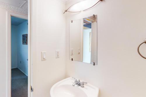 a bathroom with a sink and a mirror at Sea Colony - 610 Dover House Rd. in Bethany Beach