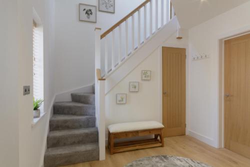 a staircase in a home with a stair case at The Orchard in Telford