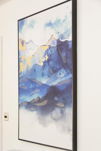 a framed painting of a mountain at The Orchard in Telford