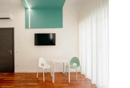 Télévision ou salle de divertissement dans l'établissement B&B Interno 5