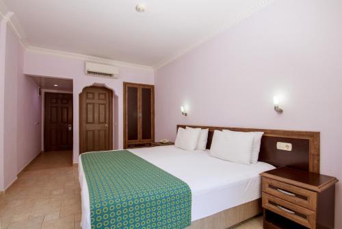 Ένα ή περισσότερα κρεβάτια σε δωμάτιο στο Flamingo Hotel & Spa - Pet Friendly