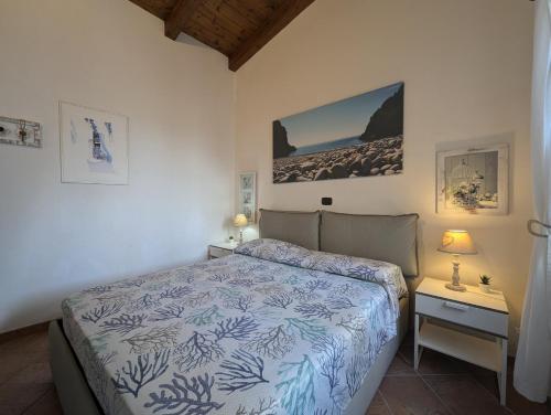 Postel nebo postele na pokoji v ubytování casa vacanze Villa BAIA-LUNA