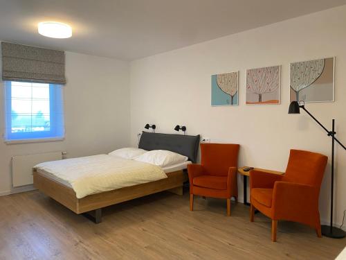 Postel nebo postele na pokoji v ubytování APARTMÁNY ŠÁRKA