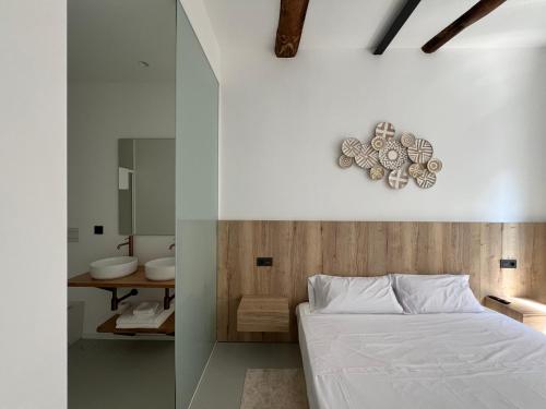 a bedroom with a bed and a bathroom at Ferrol by Miramar Stays in Ferrol