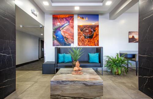 a lobby with a couch and a table at Hotel Elev8 Flagstaff, Trademark Collection by Wyndham in Flagstaff