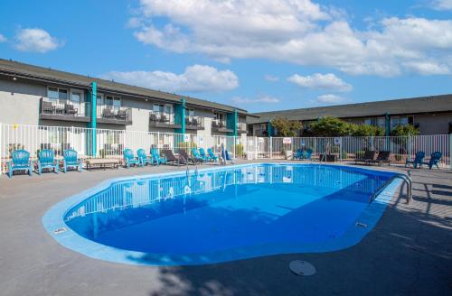 a swimming pool in front of a building at Hotel Elev8 Flagstaff, Trademark Collection by Wyndham in Flagstaff