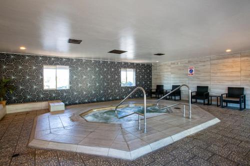 a jacuzzi tub with a slide in a room at Hotel Elev8 Flagstaff, Trademark Collection by Wyndham in Flagstaff