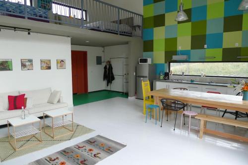 a living room with a table and a kitchen at Modern architecture with great view in San Agustín Etla