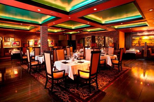 a restaurant with tables and chairs in a room at Carson Valley Inn in Minden
