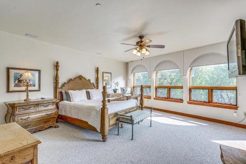 a bedroom with a bed and a ceiling fan at Expansive Edwards Condo on Main Street with Views! in Edwards