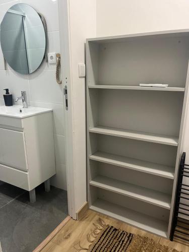 a bathroom with a sink and a mirror at Friend's House in Maia
