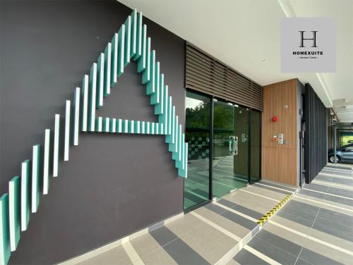 a stairwell with an arrow painted on the side of a building at Homexuite Vacation at Sri Indah 2 in Sandakan