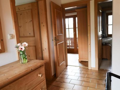 a vase of flowers sitting on a counter in a kitchen at Müller Nr 2 in Kirchberg in Tirol